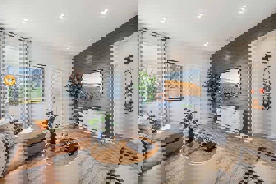 A living room with a large tv.