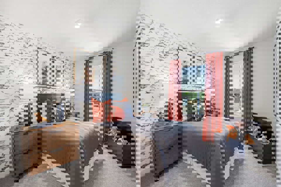 A bedroom with a bed and a couch.