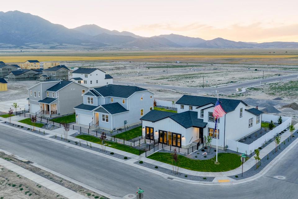 A row of houses on a road.