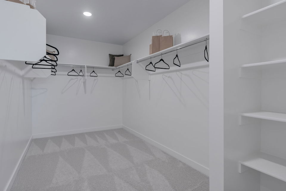 A white bathroom with a white tile floor.