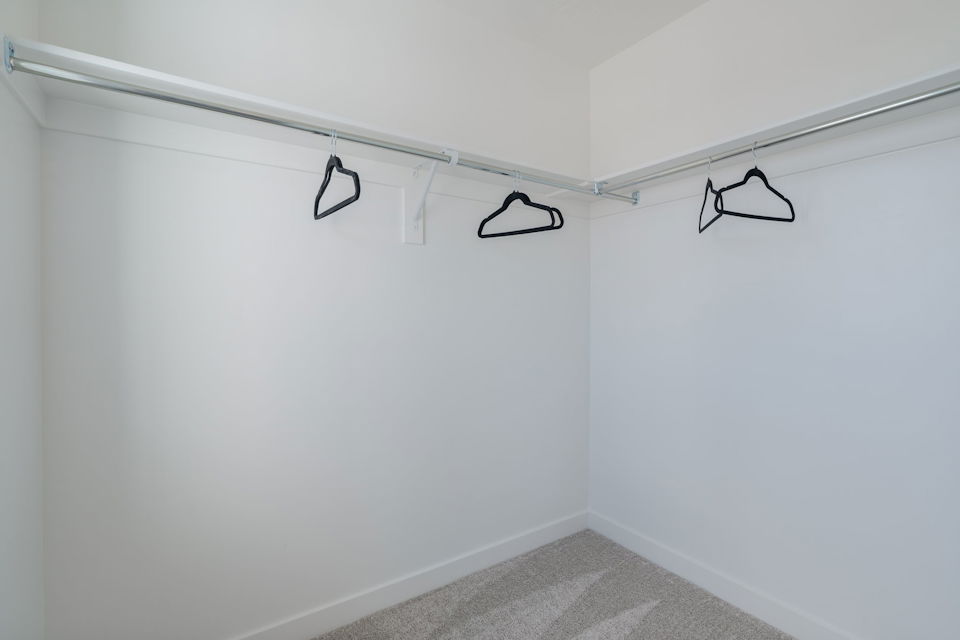 A white wall with a black circle and a black circle on it.