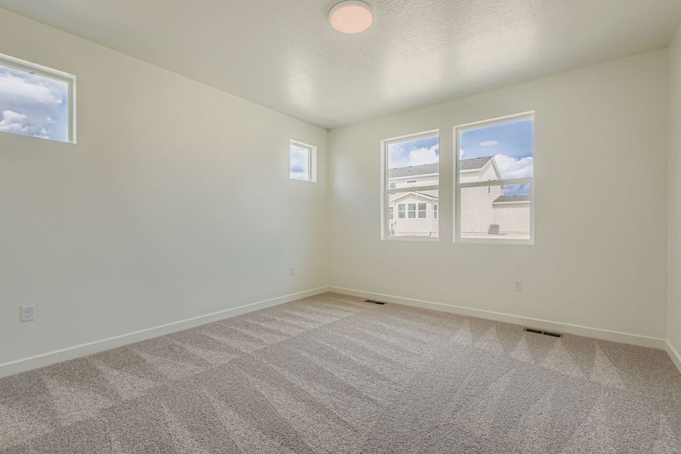 A room with a few paintings on the wall.