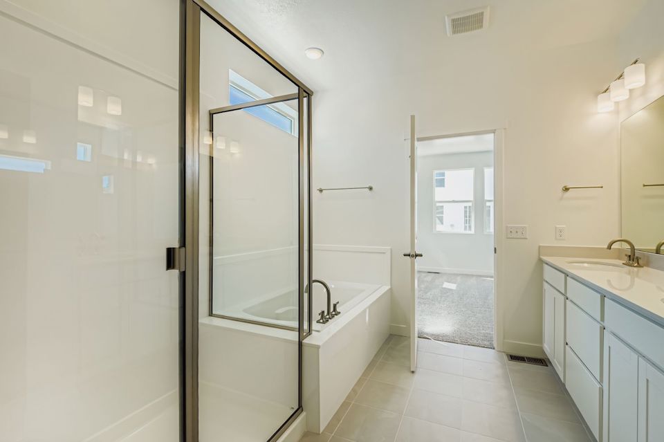 A bathroom with a glass shower.