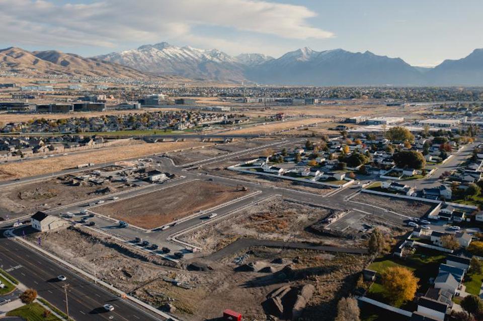 A large area with buildings and mountains in the background.