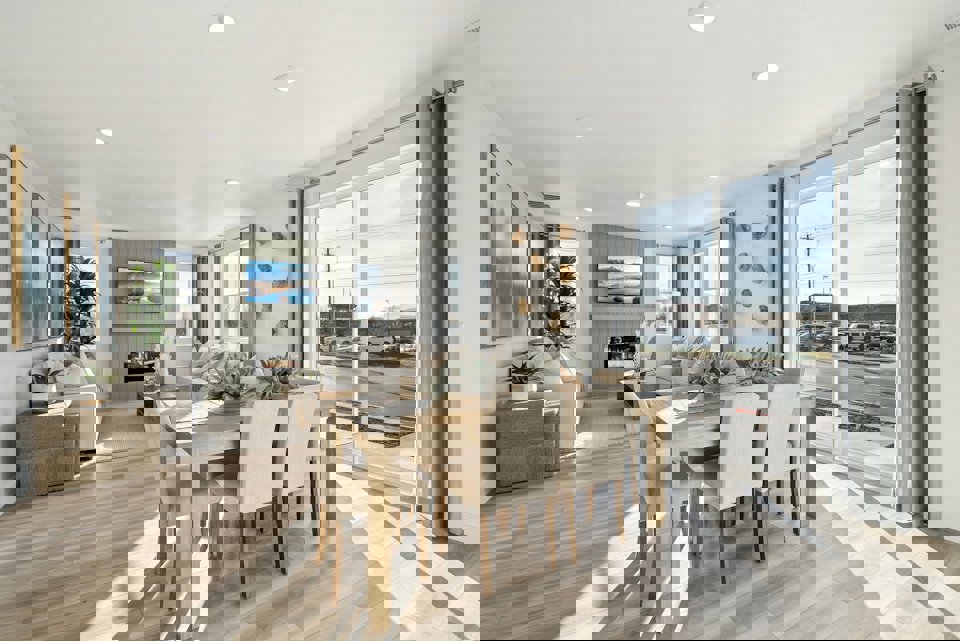 A dining room with a large window.