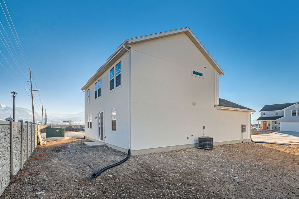 A white building with a fence around it.