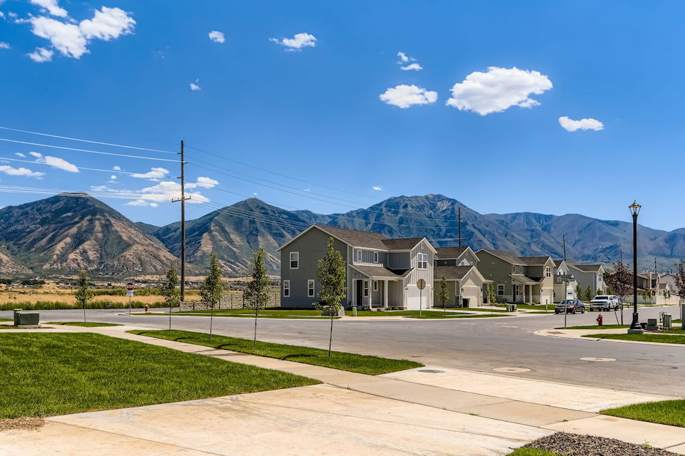 A large house with a parking lot.