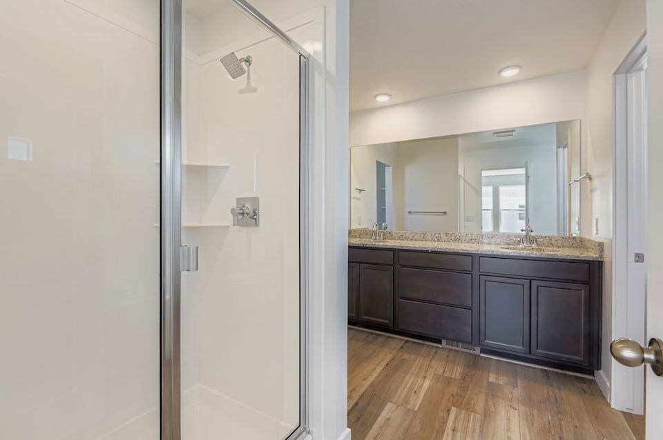 A bathroom with a glass shower.