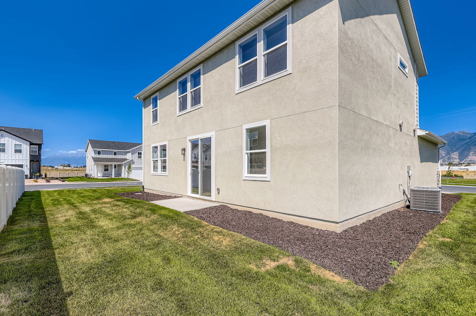 A house with a grass yard.
