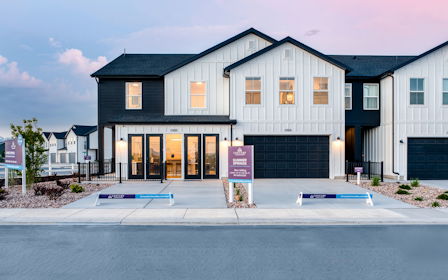 A building with a sign in front.