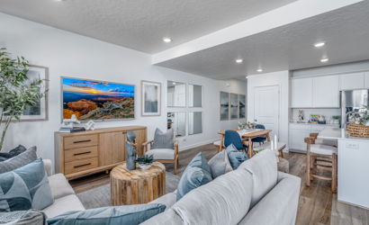 A living room with a couch and a table.