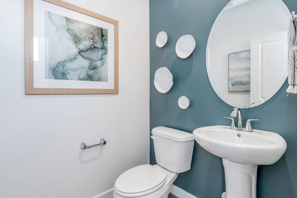 A bathroom with a toilet and a sink.
