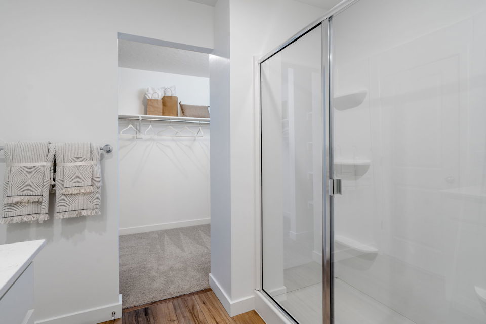 A bathroom with a glass shower.