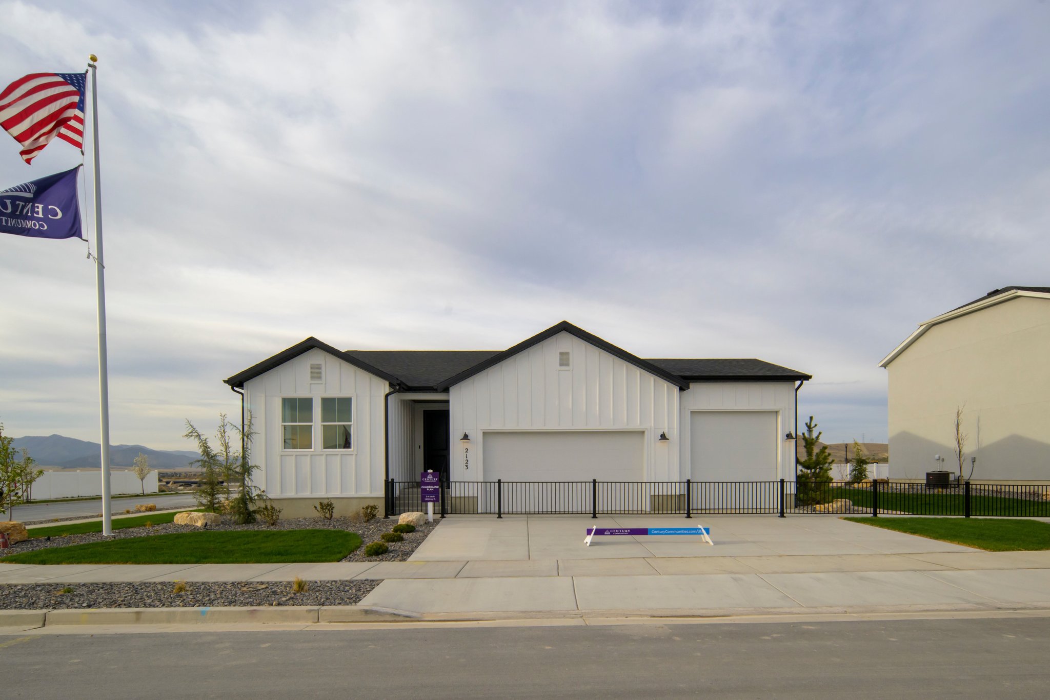 A house with flags in the front.