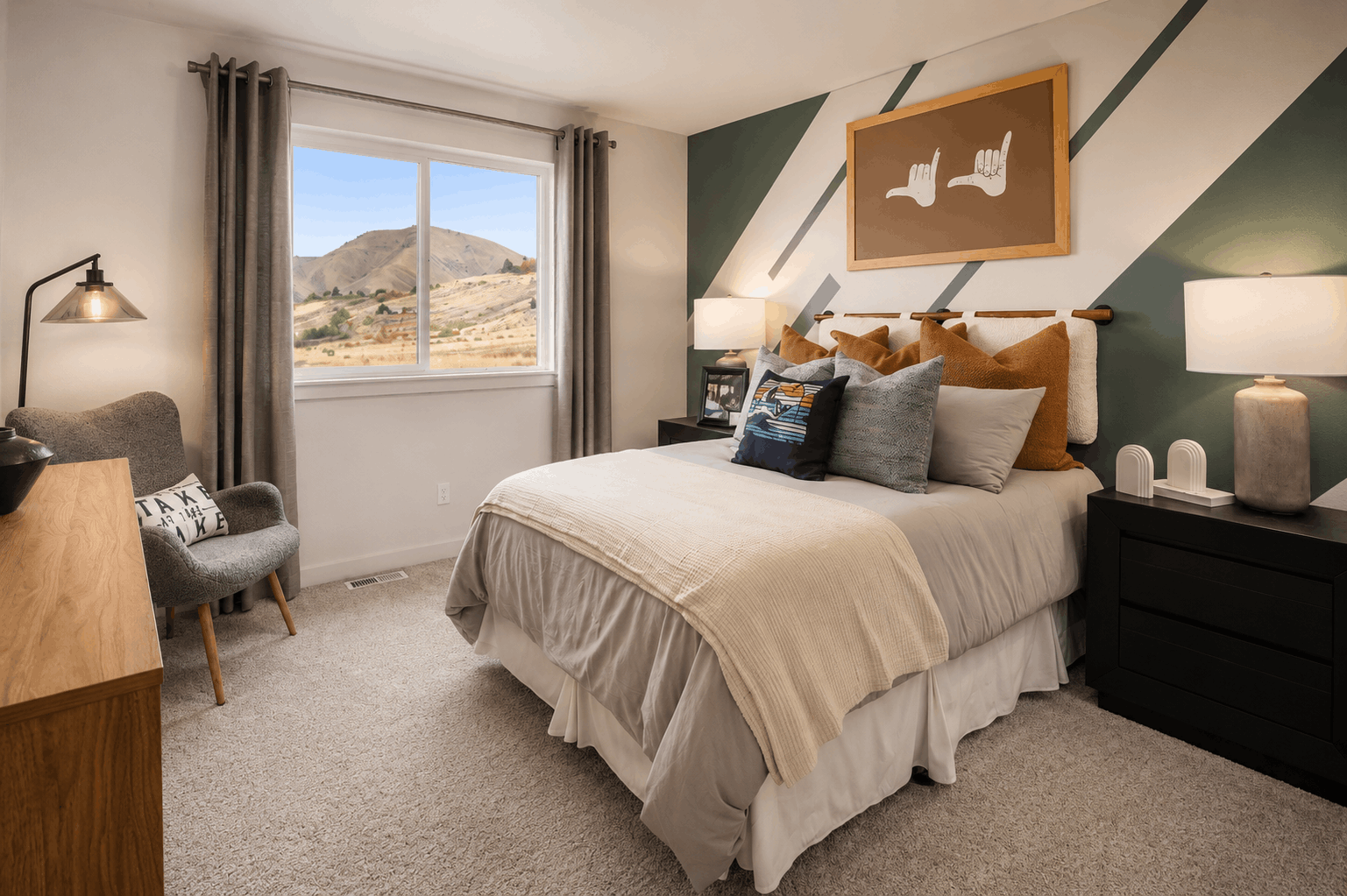 A bedroom with a large window.