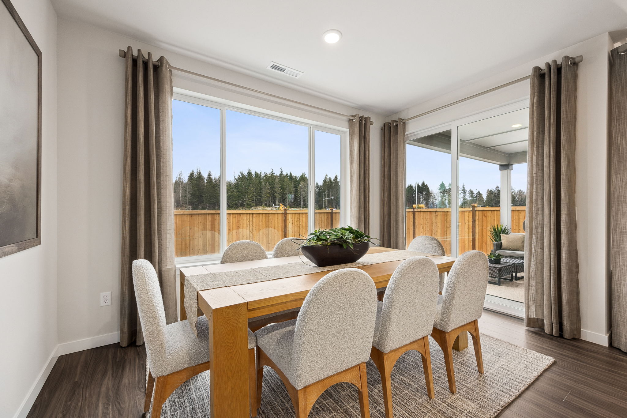 A dining room with a large window.