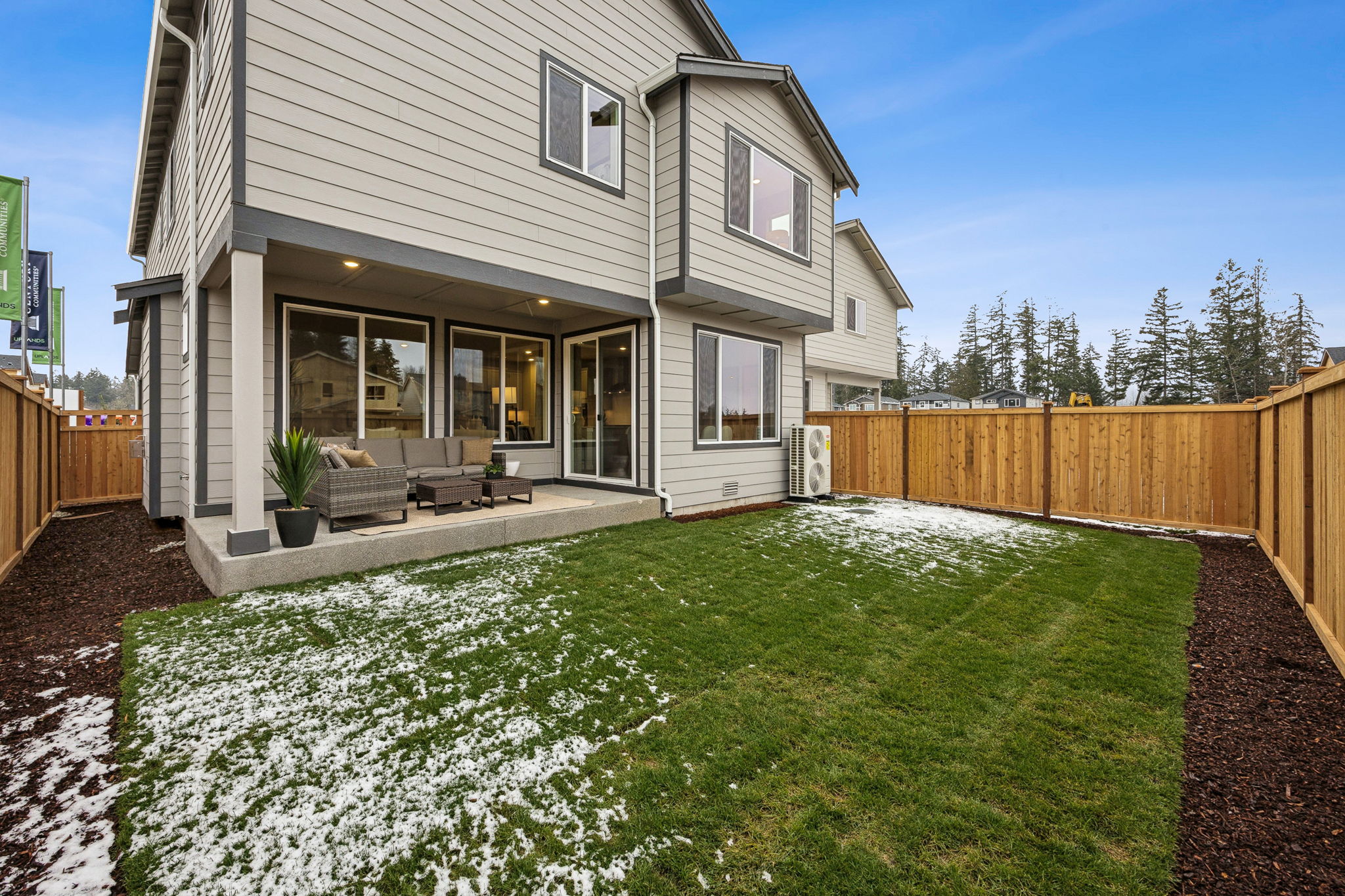 A house with a fence and grass.