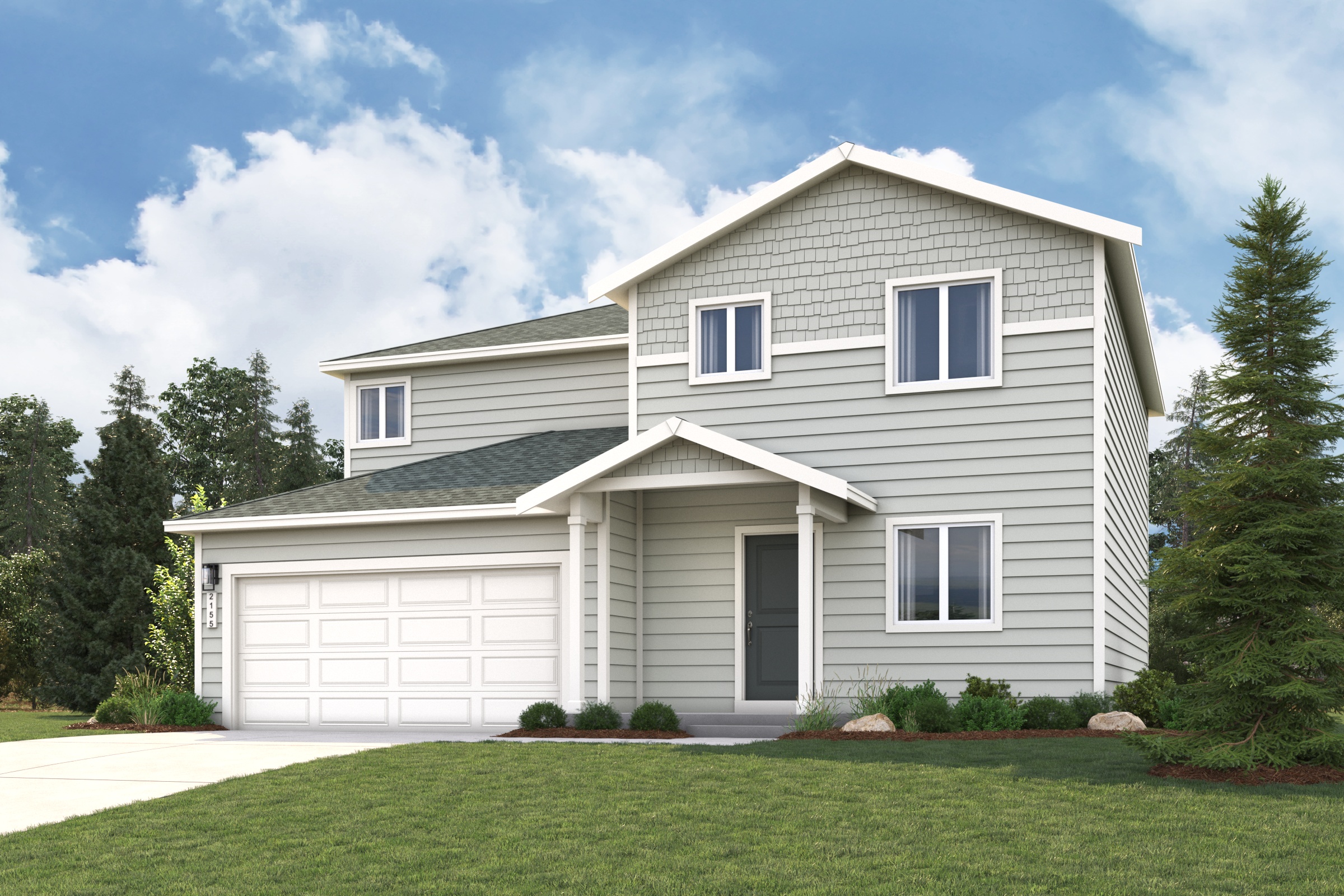 A white house with a green lawn.