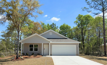 A house with trees around it.