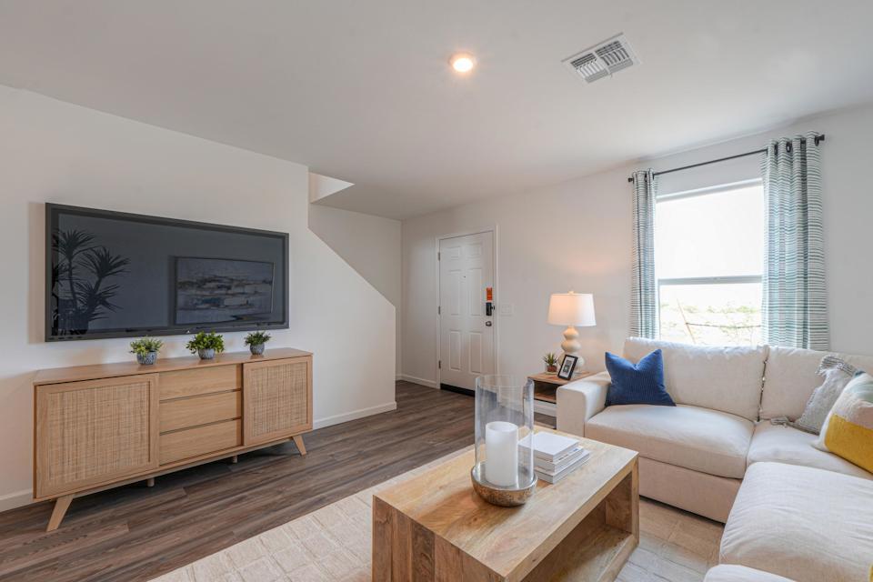 A living room with a couch and a coffee table.