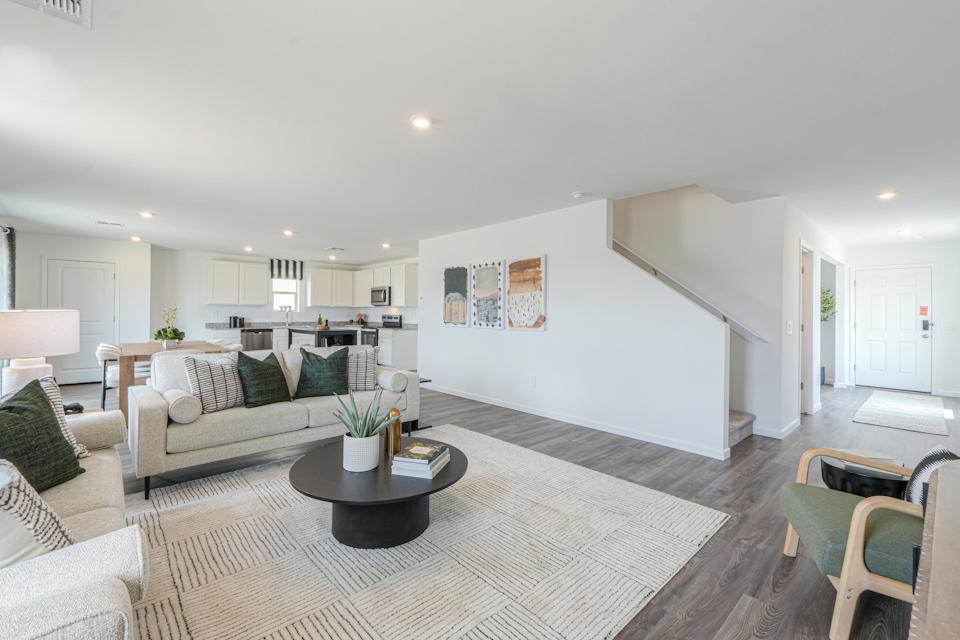 A living room with a couch and a coffee table.