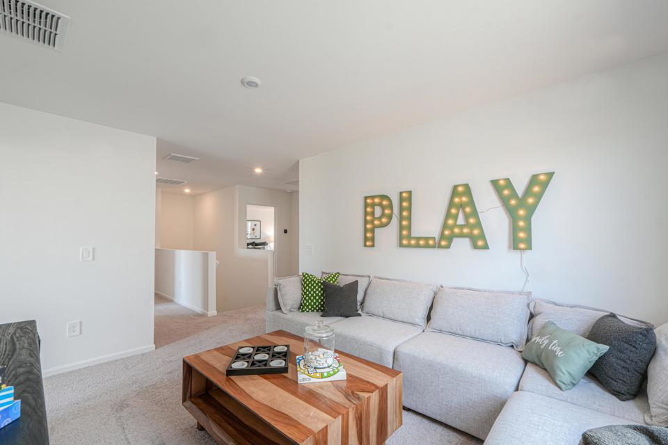 A living room with a couch and a coffee table.