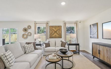 A living room with a large window.