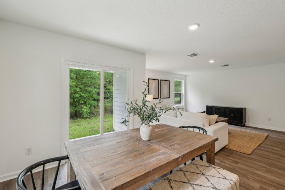 A living room with a table and couches.