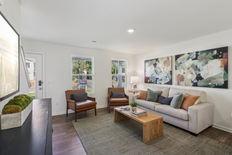 A living room with a couch and a coffee table.