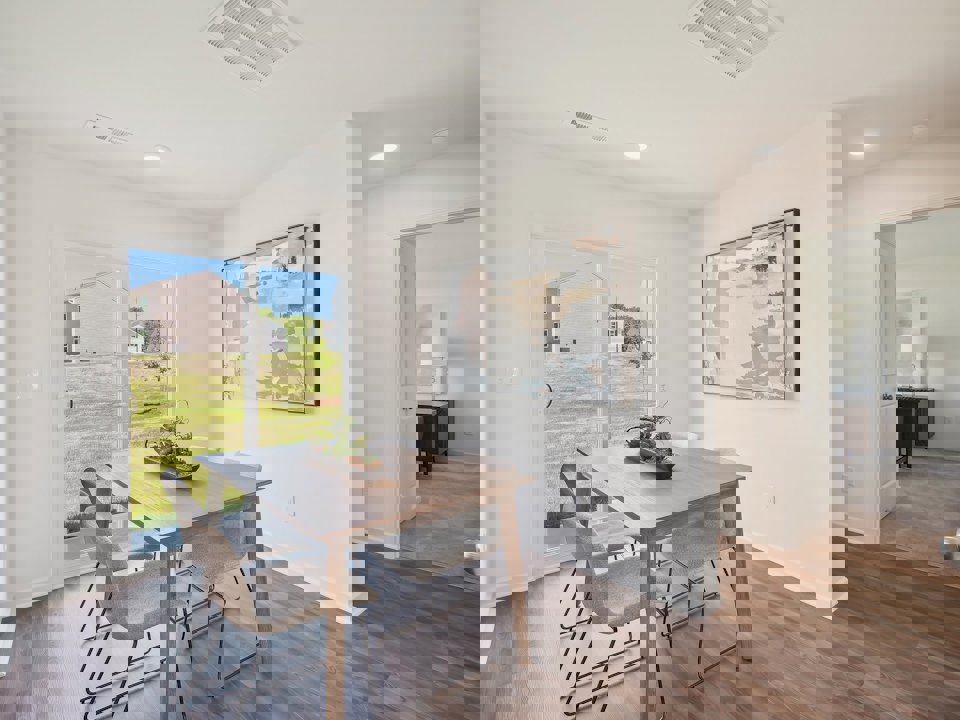 A dining room table with chairs.