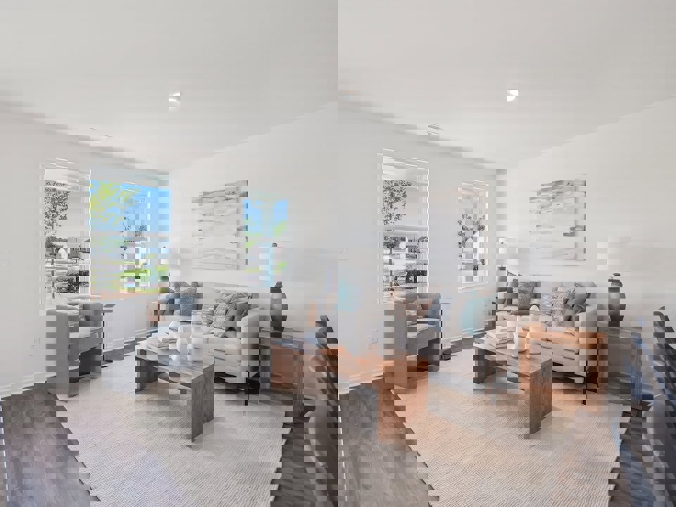 A living room with a couch and a coffee table.