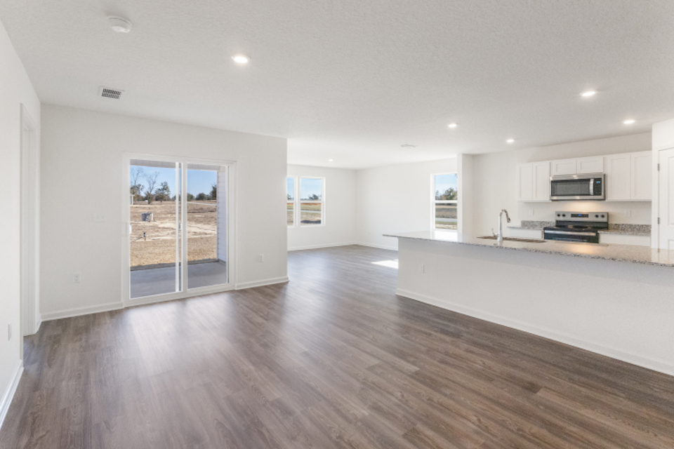 A large kitchen with white cabinets.