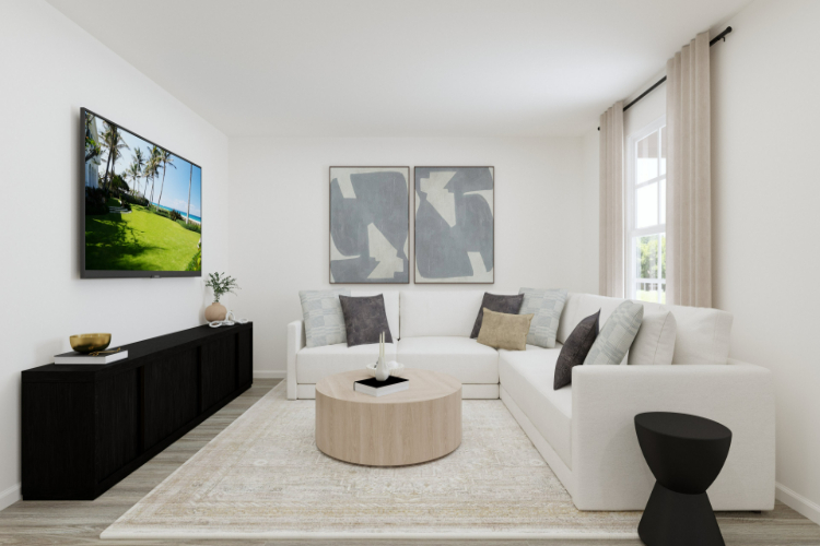 A living room with a white couch and a coffee table.