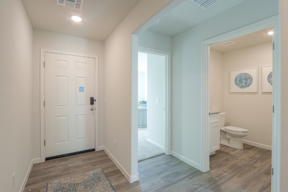 A bathroom with white doors.
