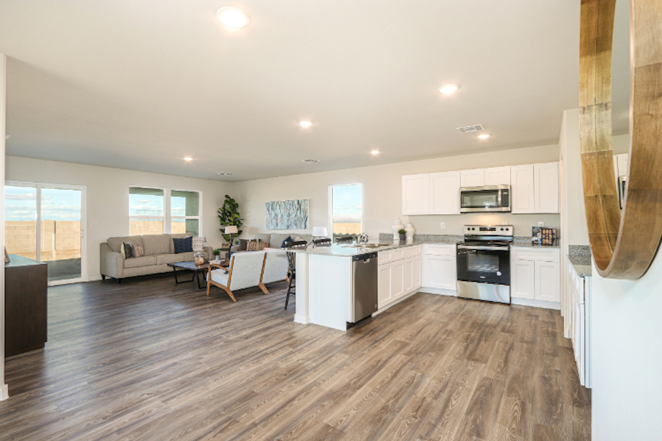 A large kitchen with white cabinets.