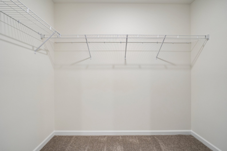 A white staircase in a room.