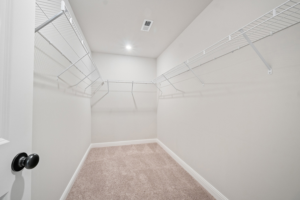 A hallway with white walls.