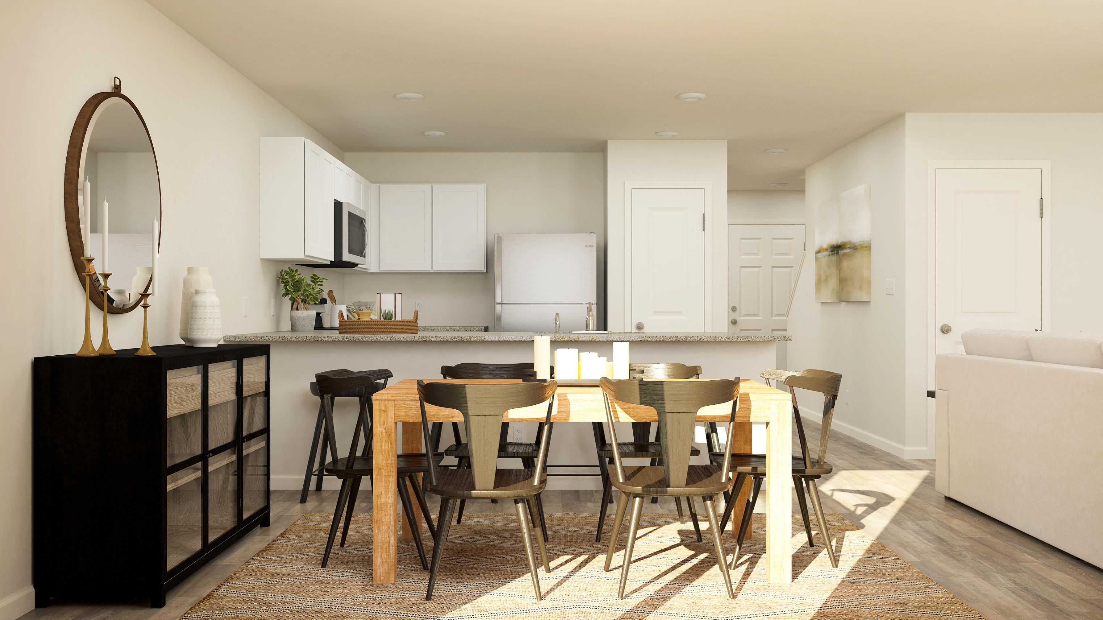 A dining room with a table and chairs.