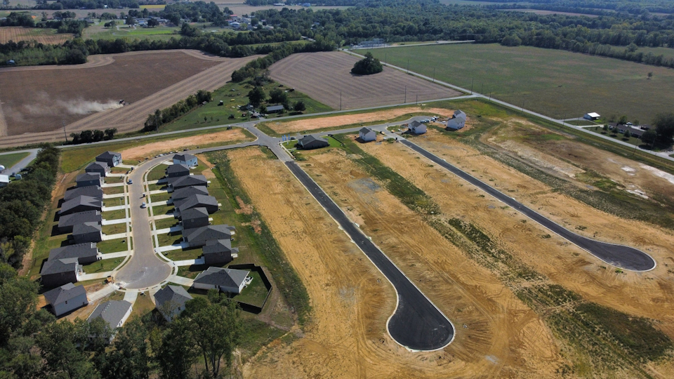A farm with many rows of crops.