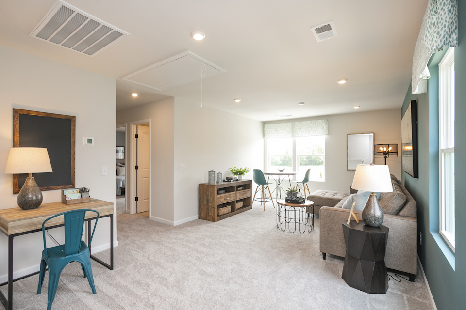 A living room with a couch and a table.