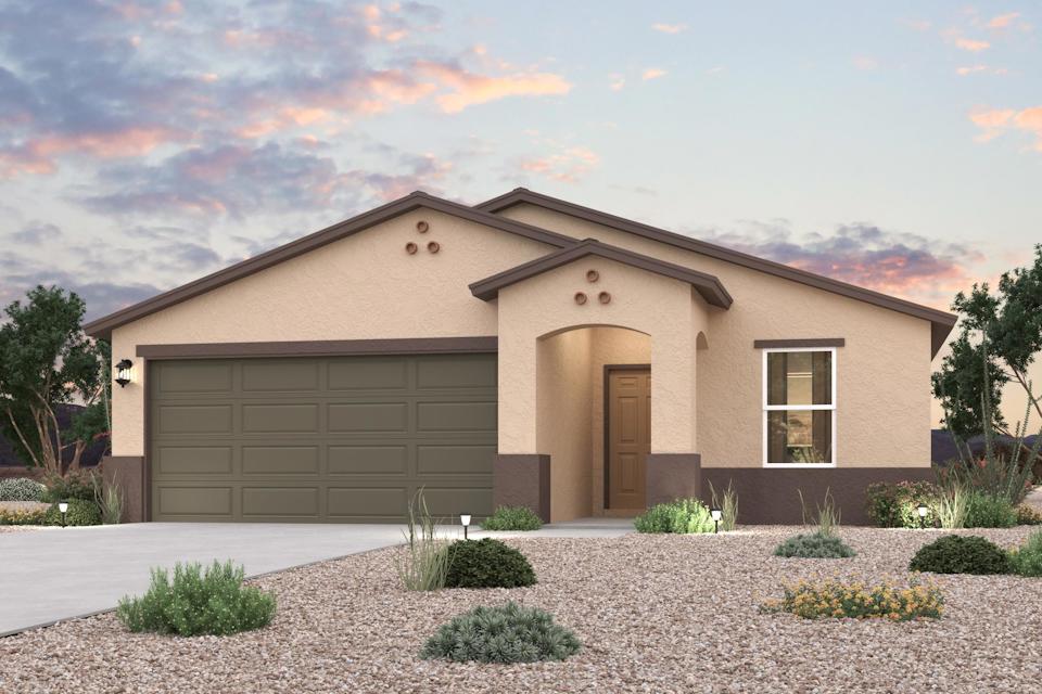A house with a gravel driveway.