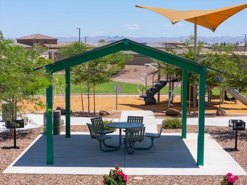 A patio with a table and chairs.