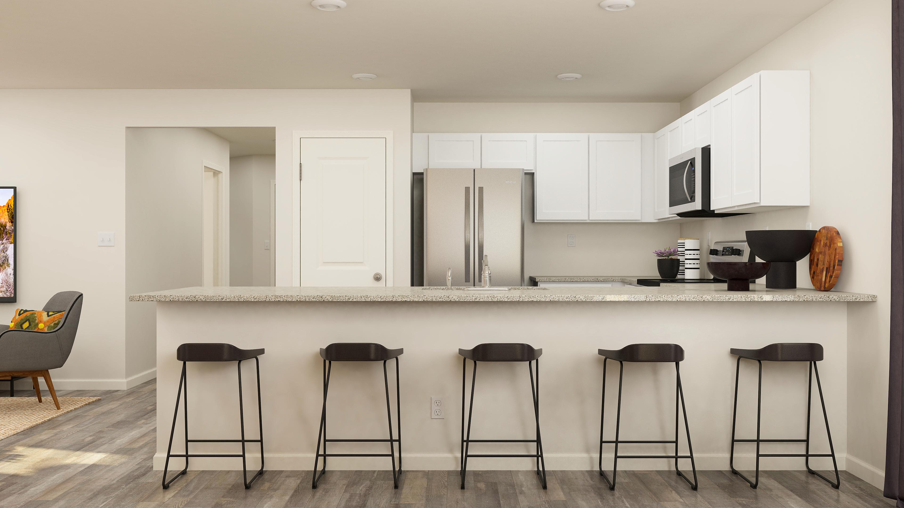 A kitchen with stools and a bar stool.