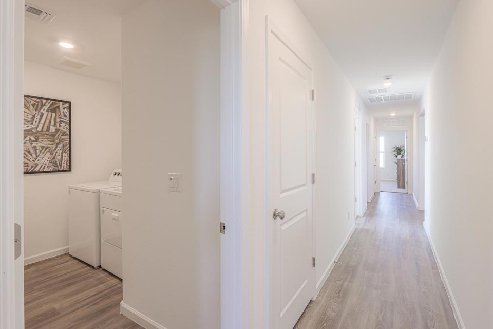A hallway with white doors.