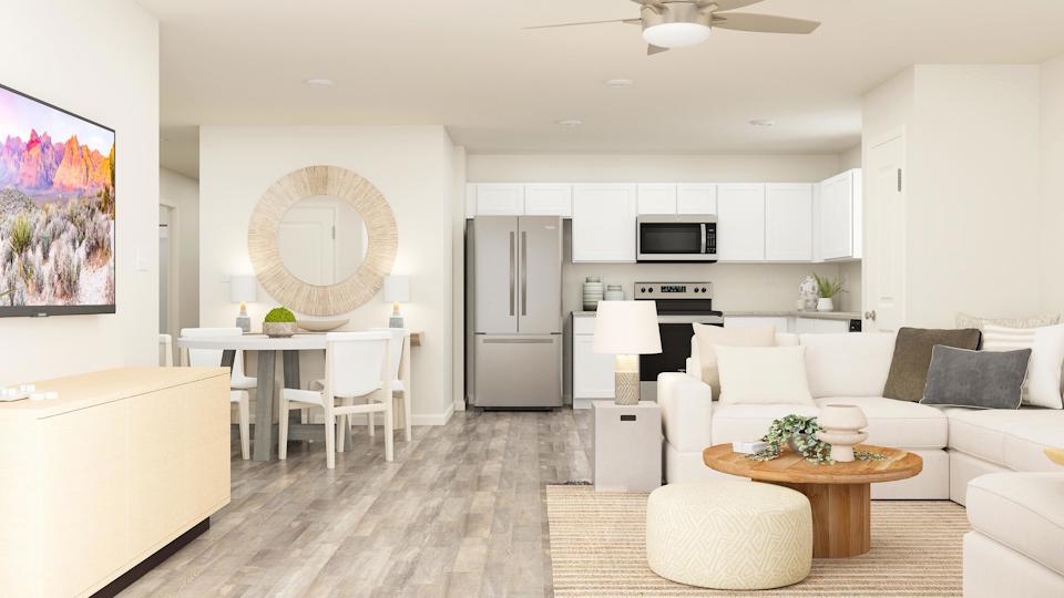 Great room opens to the kitchen and dining area.