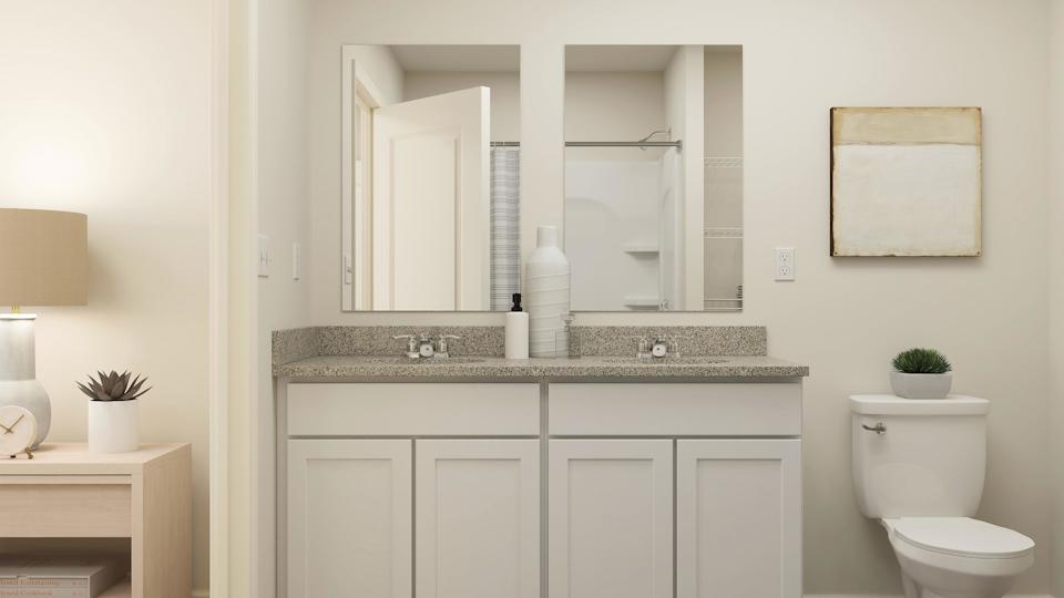 A bathroom with a sink and a toilet.