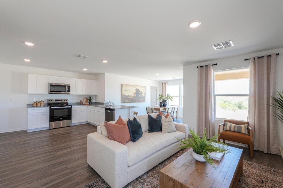 A living room with a couch and a table.