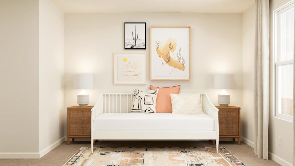 A white bed in a room.