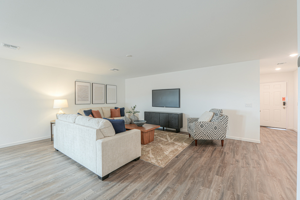 A living room with a tv and couches.