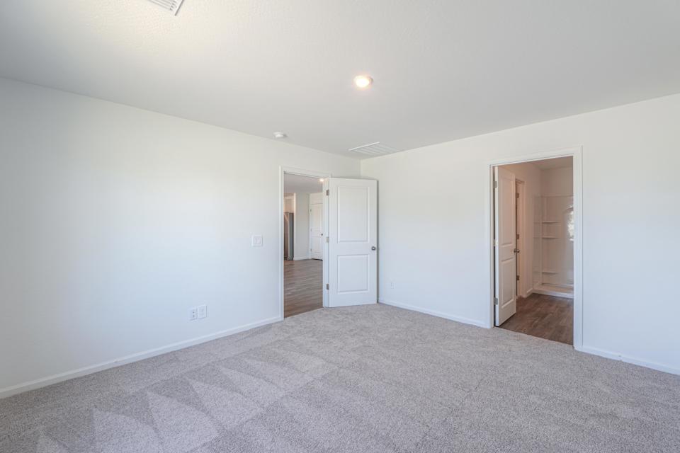 A hallway with white walls.